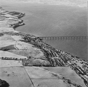 General oblique aerial view of the towns and the S end of the Tay Bridge, taken from the E.