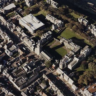 Oblique aerial view centred on the college and church, taken from the SE.