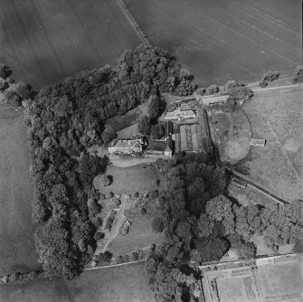 Oblique aerial view centred on the country house, taken from the S.