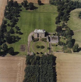 Oblique aerial view centred on the country house, garden, pavilions and lodges, taken from the SE.