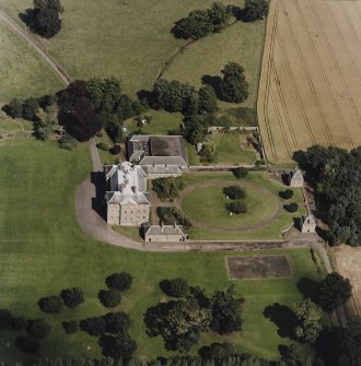 Oblique aerial view centred on the country house, garden, pavilions and lodges, taken from the WSW.