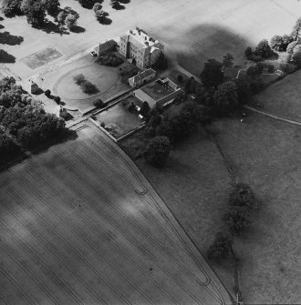 Oblique aerial view centred on the country house, garden, pavilions and lodges, taken from the E.