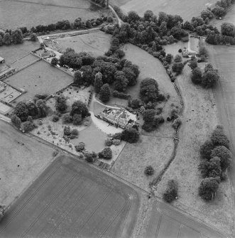 Oblique aerial photograph of Lathrisk House centred on a country house. Lathrisk Laundry house is situated to the N, in the top right of the photograph. Taken from the NE.