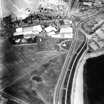 General oblique aerial view showing the position of the burial ground close to the sea.