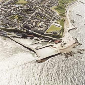 Aerial view of Banff harbour including North Pier, Beacon and town beyond.