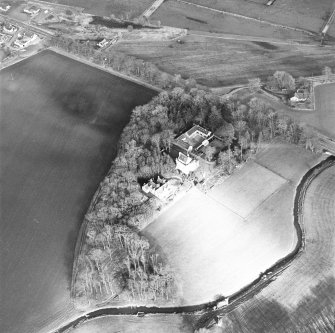 Oblique aerial view centred on the castle and tower-house, taken from the SW.