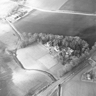 Oblique aerial view centred on the castle and tower-house, taken from the SE.