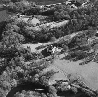 Oblique aerial view centred on the castle and tower-house, taken from the NW.