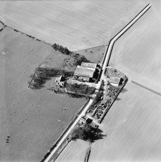 Oblique aerial view centred on the remains of the abbey and the house, farmhouse and farmsteading, taken from the NE.