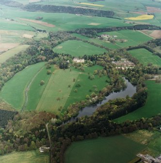 Oblique aerial view centred on Fyvie Castle and policies, with walled garden adjacent, taken from the S.