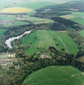 Oblique aerial view centred on Fyvie Castle and policies, with walled garden adjacent, taken from the NNE.