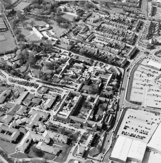 Oblique aerial view centred on the hospital, obelisk, and mill, taken from the SE.