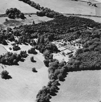 Oblique aerial view of Leith Hall centred on the country house and walled garden, taken from the NE.