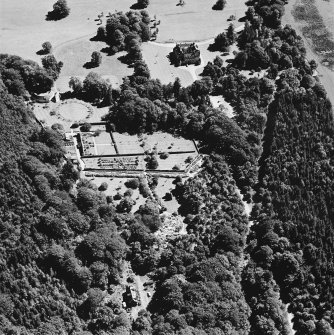 Oblique aerial view of Leith Hall centred on the country house, walled garden and offices, taken from the WNW.