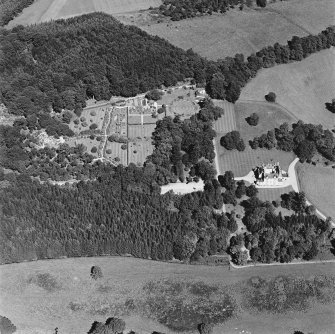 Oblique aerial view of Leith Hall centred on the country house, walled garden and offices, taken from the SSW.