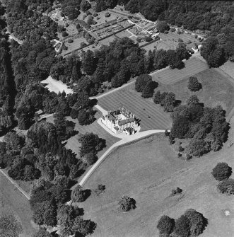 Oblique aerial view of Leith Hall centred on the country house, walled garden and offices, taken from the SE.