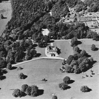 Oblique aerial view of Leith Hall centred on the country house, walled garden and offices, taken from the ESE.