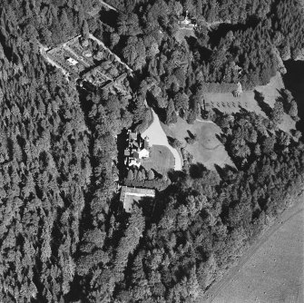 Oblique aerial view of Candacraig House and grounds centred on the country house, taken from the WSW.