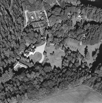 Oblique aerial view of Candacraig House and grounds centred on the country house, taken from the SW.
