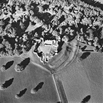 Oblique aerial view of Kildrummy Castle centred on the remains of a castle, taken from the SE.