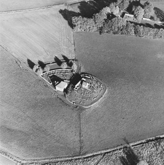 Oblique aerial view of Kildrummy, St Bride's Chapel and Well centred on the chapel with a possible motte and churchyard adjacent, taken from the SW.