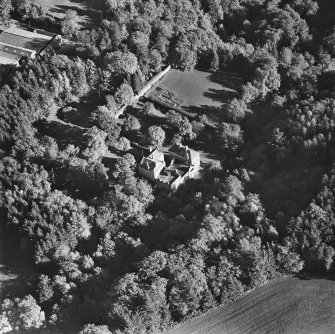 Oblique aerial view of Craig Castle centred on the castle with walled garden and farmsteading adjacent, taken from the NW.
