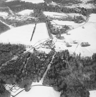 Oblique aerial view of country house taken from the SW.