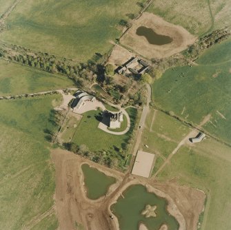 Oblique aerial view centred on the tower-house taken from the NW.