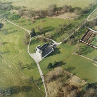 Oblique aerial view centred on the tower-house, taken from the SE.