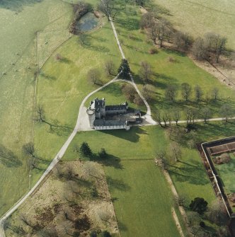 Oblique aerial view centred on the tower-house, taken from the E.