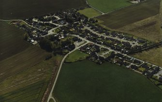 Oblique aerial view centred on the village, taken from the NNE.