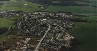 Oblique aerial view centred on the village, taken from the N.