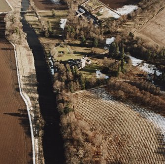 Oblique aerial view centred on the tower-house taken from the WNW.