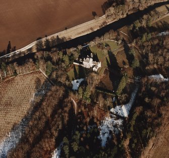 Oblique aerial view centred on the tower-house taken from the SW.