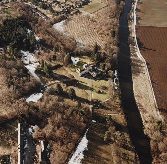 Oblique aerial view centred on the tower-house taken from the SE.