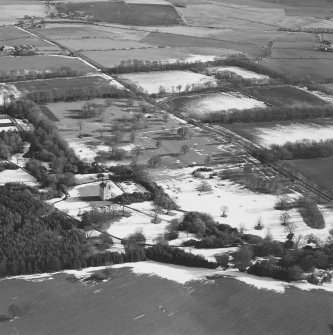 Oblique aerial view centred on Udny Castle and gardens taken from the WNW.