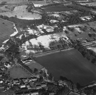 Oblique aerial view centred on Udny Castle and gardens taken from the SSW.