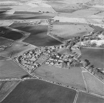 Oblique aerial view of Udny Green village taken from the SE.