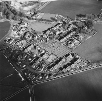 Oblique aerial view of Udny Green village taken from the SW.