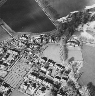 Oblique aerial view of Udny Green village taken from the SE.