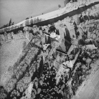 Oblique aerial view centred on the tower-house taken from the SW.