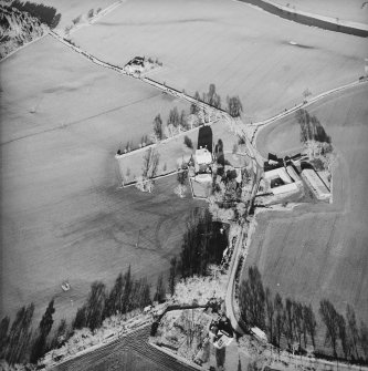 Oblique aerial view centred on the tower-house taken from the NW.
