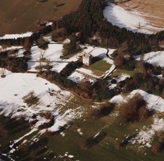Oblique aerial view centred on Udny Castle and gardens taken from the SE.