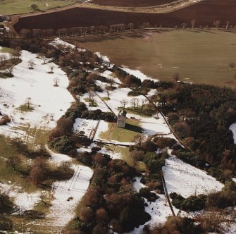 Oblique aerial view centred on Udny Castle and gardens taken from the ENE.