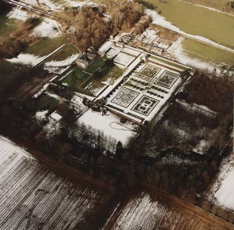 Oblique aerial view centred on the country house and garden, taken from the SSE.