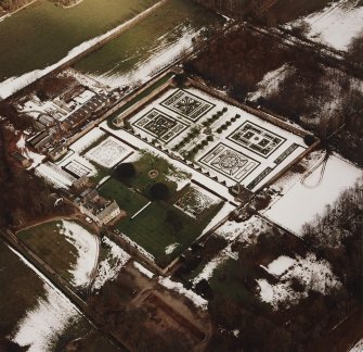Oblique aerial view centred on the country house and garden, taken from the SW.