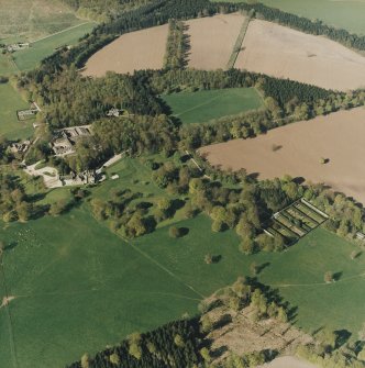 Oblique aerial view of the country house, farmsteading and walled garden, taken from the SSW.