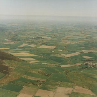 General oblique aerial view of landscape of the Garioch looking over Rhynie village from the area of Tap o' Noth hillfort, taken from the W.