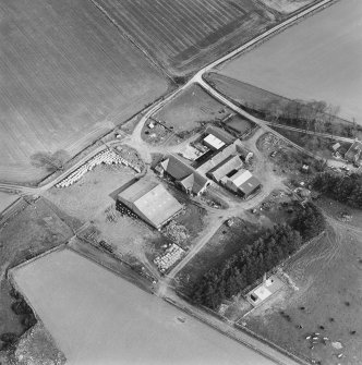 Oblique aerial view centred on the farmstead, taken from the NW.