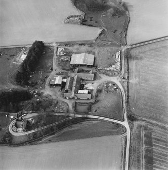 Oblique aerial view centred on the farmstead, taken from the SSE.